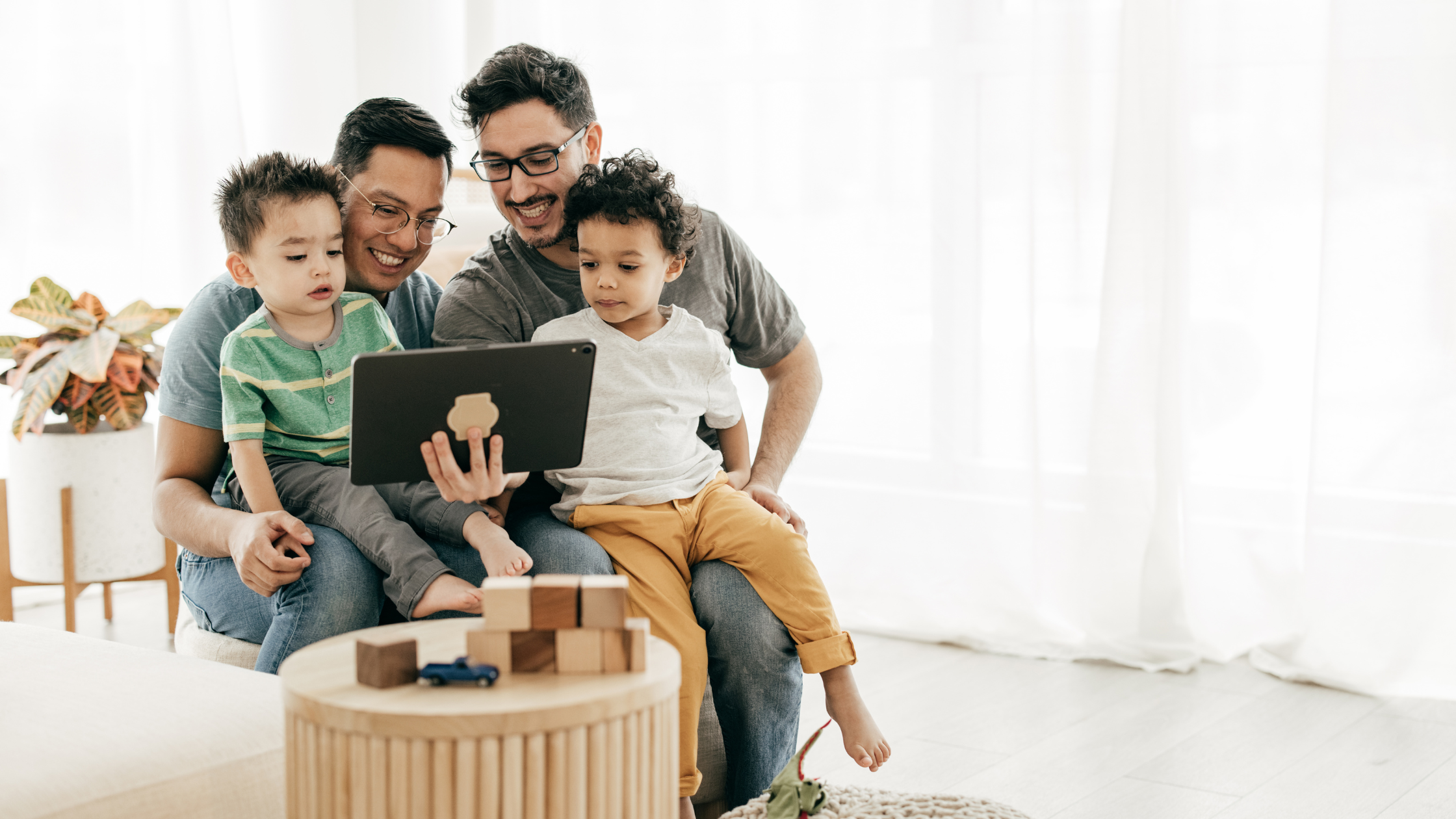 Happy same-sex couple and their children