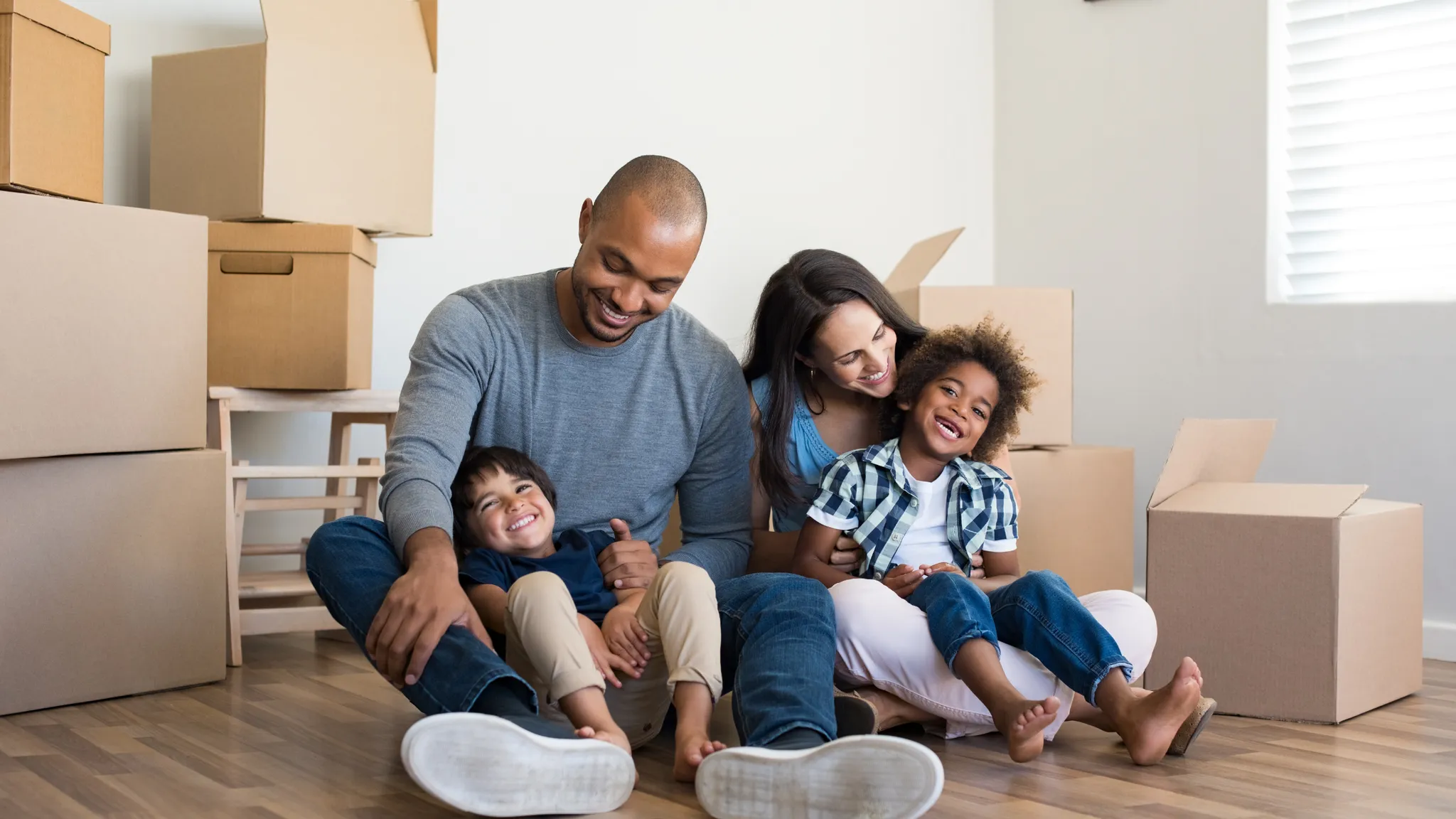 Family sitting and having a good time on the floor